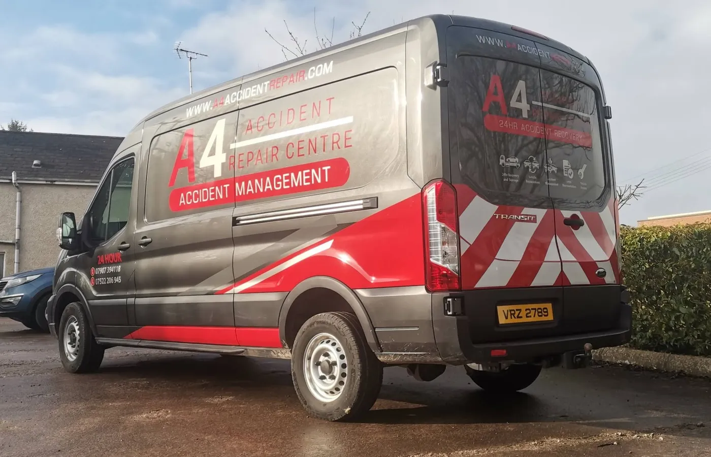 A4 Accident Repair Centre transit van finished in a grey, red and chevron vinyl wrap.