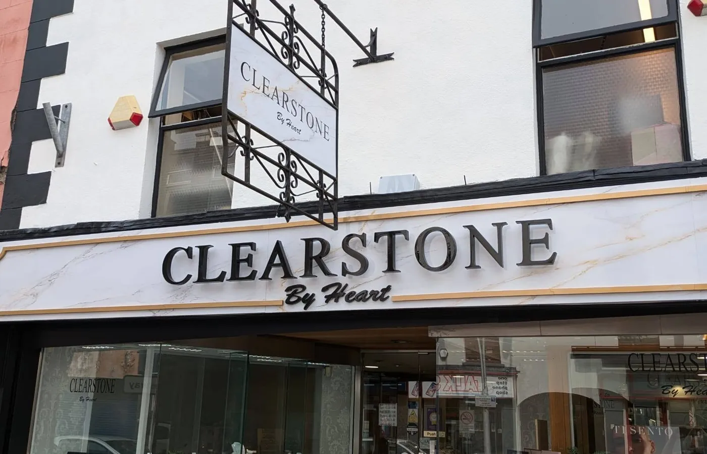 Clearstone by Heart jewellery shop front with a wrought-iron hanging sign and marble-effect fascia lettering.